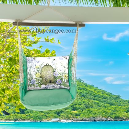 In a poolside chaise a green outdoor swing crafted by the artisans of Magnolia Casual called the Swing Set 4 piece Seafoam Green Solid w/ Bee Skep is displayed featuring 100 percent weather resistant fabric, weather resistant polyester fabric, handcrafted adding comfort and style to the space featuring with a bee motif and shades of green.