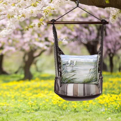 In a poolside chaise a gray outdoor swing crafted by the artisans of Magnolia Casual called the Swing Set 4 piece Slate Gray Stripe w/ Seagulls is displayed featuring 100 percent weather resistant fabric, weather resistant polyester fabric, handcrafted adding comfort and style to the space featuring with a stripe motif and shades of gray.