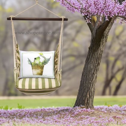 In a sunlit patio lounge a multi colored outdoor swing crafted by the artisans of Magnolia Casual called the Swing Set 4 piece Summer Palms Stripe w/ Frog in Pot is displayed featuring 100 percent weather resistant fabric, weather resistant polyester fabric, handcrafted adding comfort and style to the space featuring with a stripe motif.
