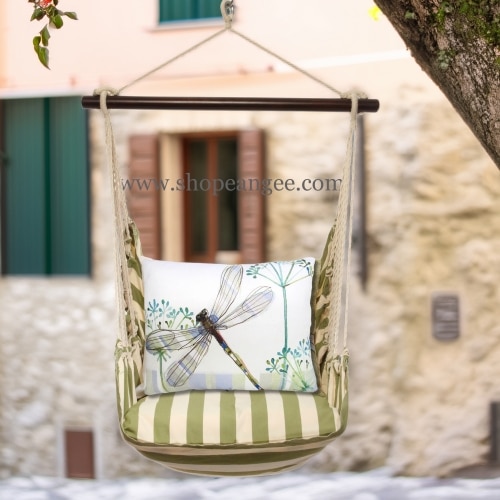 In an outdoor reading nook a multi colored outdoor swing crafted by the artisans of Magnolia Casual called the Swing Set 4 piece Summer Palms Stripe w/ Dragonfly Wisp is displayed featuring 100 percent weather resistant fabric, weather resistant polyester fabric, handcrafted adding comfort and style to the space featuring with a stripe motif.