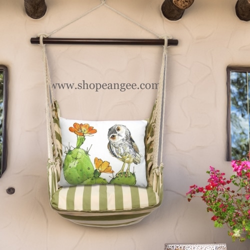 In a poolside chaise a multi colored outdoor swing crafted by the artisans of Magnolia Casual called the Swing Set 4 piece Summer Palms Stripe w/ Owl on Prickly Cactus is displayed featuring 100 percent weather resistant fabric, weather resistant polyester fabric, handcrafted adding comfort and style to the space featuring with a stripe motif.