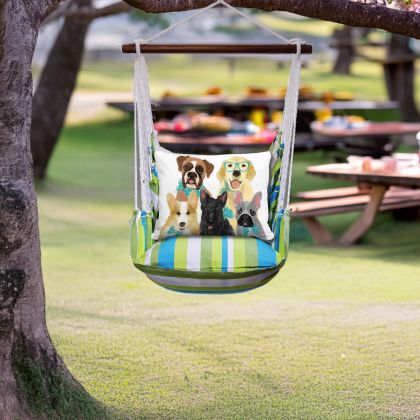In an outdoor reading nook a multi colored outdoor swing crafted by the artisans of Magnolia Casual called the Swing Set 4 piece Beach Boulevard Stripe w/ Dog Portrait is displayed featuring 100 percent weather resistant fabric, weather resistant polyester fabric adding comfort and style to the space featuring with a stripe motif.