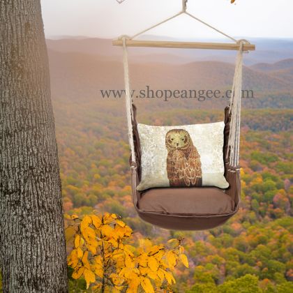 In a sunlit patio lounge a multi colored outdoor swing crafted by the artisans of Magnolia Casual called the Swing Set 4 piece Chocolate Solid w/ Owl Portrait is displayed featuring 100 percent weather resistant fabric, weather resistant polyester fabric, artisan, natural materials adding comfort and style to the space featuring with a owl motif.