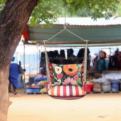 In a poolside chaise a multi colored outdoor swing crafted by the artisans of Magnolia Casual called the Swing Set 4 piece Cristina Stripe w/ Spring Fling is displayed featuring 100 percent weather resistant fabric, weather resistant polyester fabric, handcrafted adding comfort and style to the space featuring with a stripe motif.