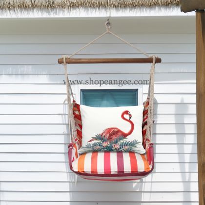In an outdoor reading nook a pink outdoor swing crafted by the artisans of Magnolia Casual called the Swing Set 4 piece Cristina Stripe w/ Vivid Flamingo Pink is displayed featuring 100 percent weather resistant fabric, weather resistant polyester fabric, handcrafted adding comfort and style to the space featuring with a stripe motif and shades of pink.