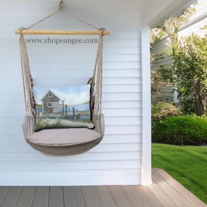 In a coastal inspired deck chair a gray outdoor swing crafted by the artisans of Magnolia Casual called the Swing Set 4 piece Gray Solid w/ Boat House Pier is displayed featuring 100 percent weather resistant fabric, weather resistant polyester fabric, handcrafted adding comfort and style to the space featuring shades of gray.