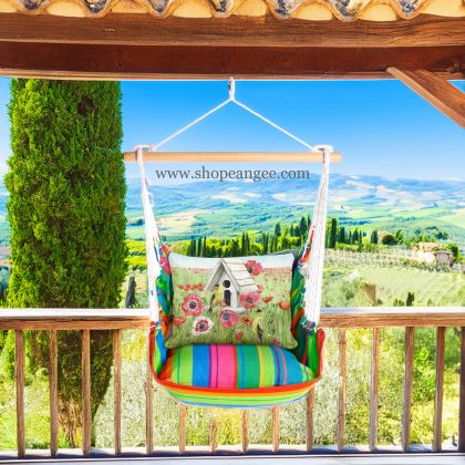 In a poolside chaise a yellow outdoor swing crafted by the artisans of Magnolia Casual called the Swing Set 4 piece Le Jardin Nouveau w/ Yellow Birds and Poppy Field is displayed featuring 100 percent weather resistant fabric, weather resistant polyester fabric, handcrafted adding comfort and style to the space featuring shades of yellow.