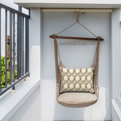 In a cozy garden seating area a multi colored outdoor swing crafted by the artisans of Magnolia Casual called the Swing Set 4 piece Latte Solid w/ Vintage Mirrors is displayed featuring 100 percent weather resistant fabric, weather resistant polyester fabric, handcrafted adding comfort and style to the space.