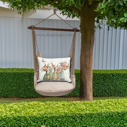 In a sunlit patio lounge a multi colored outdoor swing crafted by the artisans of Magnolia Casual called the Swing Set 4 piece Latte Solid w/ Flowers in Glass Bottles is displayed featuring 100 percent weather resistant fabric, weather resistant polyester fabric, handcrafted adding comfort and style to the space.