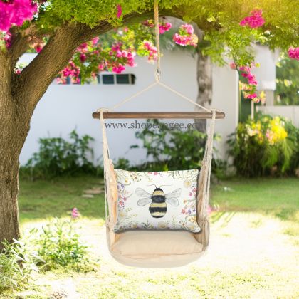 In a shaded porch swing a multi colored outdoor swing crafted by the artisans of Magnolia Casual called the Swing Set 4 piece Magnolia Stripe w/ Floral Bee is displayed featuring 100 percent weather resistant fabric, weather resistant polyester fabric, handcrafted adding comfort and style to the space featuring with a magnolia motif.