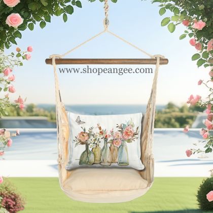 In an outdoor reading nook a multi colored outdoor swing crafted by the artisans of Magnolia Casual called the Swing Set 4 piece Magnolia Stripe w/ Flowers in Glass Bottles is displayed featuring 100 percent weather resistant fabric, weather resistant polyester fabric, handcrafted adding comfort and style to the space featuring with a magnolia motif.