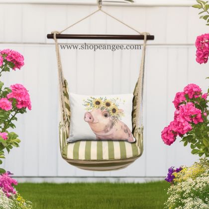In an outdoor reading nook a multi colored outdoor swing crafted by the artisans of Magnolia Casual called the Swing Set 4 piece Summer Palms Stripe w/ Pig with Sunflowers is displayed featuring 100 percent weather resistant fabric, weather resistant polyester fabric, handcrafted adding comfort and style to the space featuring with a stripe motif.