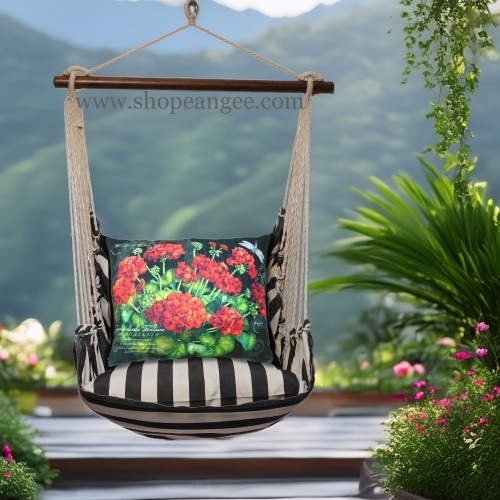 In a cozy garden seating area a black outdoor swing crafted by the artisans of Magnolia Casual called the Swing Set 4 piece True Black Stripe w/ Geranium on Black is displayed featuring 100 percent weather resistant fabric, weather resistant polyester fabric, handcrafted adding comfort and style to the space featuring with a stripe motif and shades of black.
