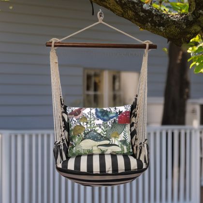 In a poolside chaise a black outdoor swing crafted by the artisans of Magnolia Casual called the Swing Set 4 piece True Black Stripe w/ Botanical Mushrooms 2 is displayed featuring 100 percent weather resistant fabric, weather resistant polyester fabric, handcrafted adding comfort and style to the space featuring with a stripe motif and shades of black.