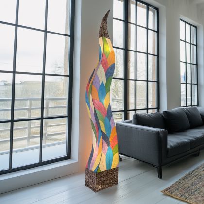 In a modern interior with earth tones, crafted by the artisans of Eangee Home Design, the Flame Giant Lamp in multi color stands gracefully, featuring fossilized cocoa leaf shade, abaca rope accents, fair trade, adding warmth and character to the space.