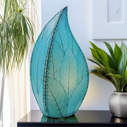 Leaf?shaped Leaflet table lamp crafted by Eangee Home Design with sea blue fossilized cocoa leaves stitched by hand to wrought iron; budding?leaf form breathes life as glowing light pours through translucent cocoa leaves; artisan?made from sustainable materials