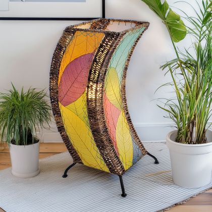 Sculptural table lamp crafted by Eangee Home Design fashioned from multi color natural leaves; organic texture revealed as warm light spills through every vein; eco?friendly, artisan?crafted design