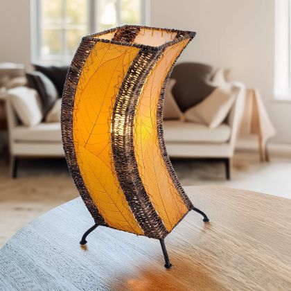 Sculptural table lamp crafted by Eangee Home Design fashioned from orange natural leaves; organic texture revealed as inviting light shines across the textured leaf panels; handcrafted sustainably by fair?trade artisans