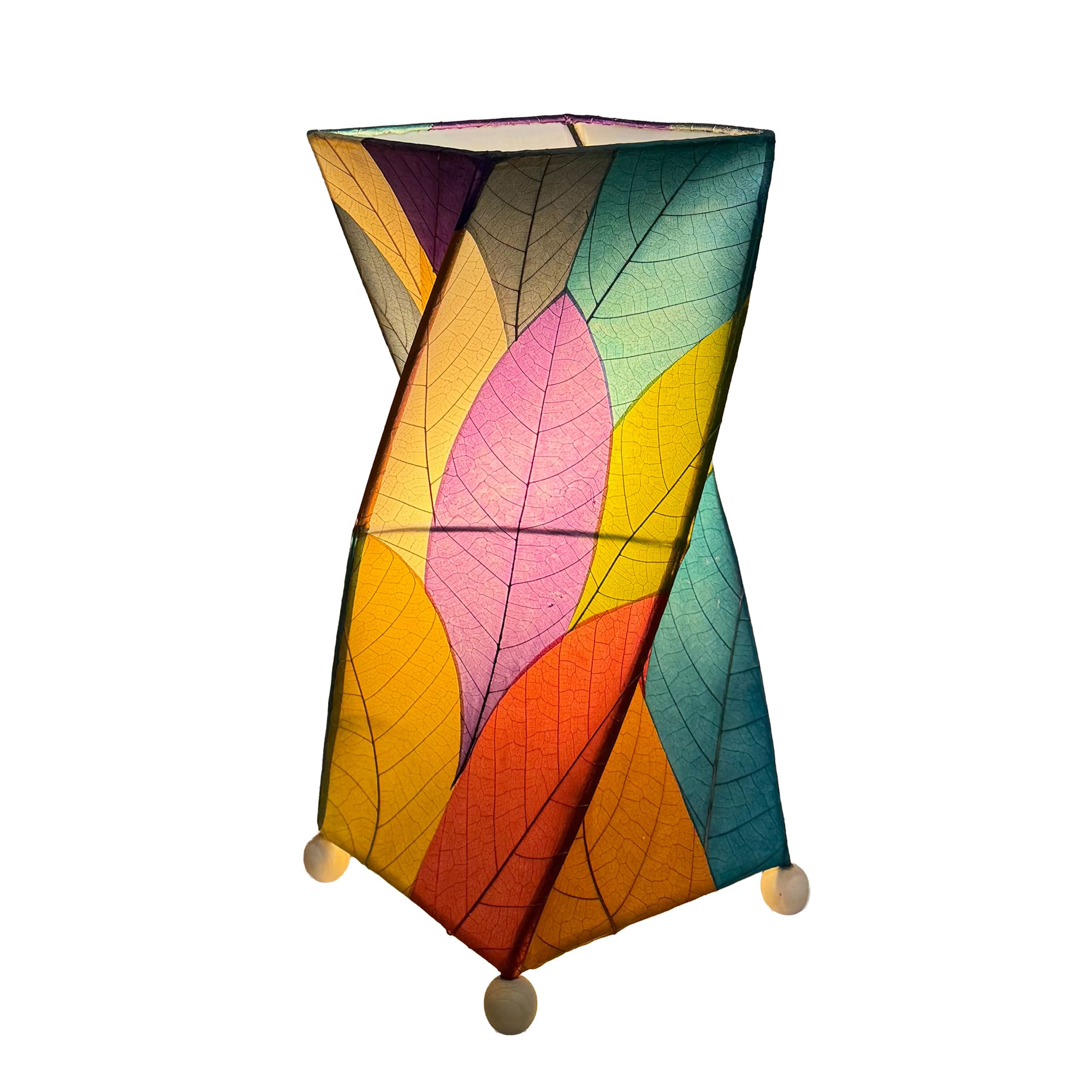 Crafted by the artisans of Eangee Home Design, the Twist Table Lamp in multi color against a clean backdrop, featuring fossilized cocoa leaf shade, wrought iron frame, handcrafted.
