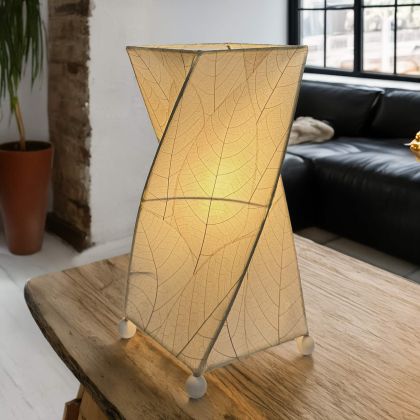Twisted cube table lamp crafted by Eangee Home Design clad in vertical natural fossilized cocoa leaves; 90?degree rotation adds dynamism while cozy light spills through every vein; sustainably handcrafted by skilled artisans