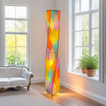 The Twist Giant Floor crafted by the artisans of Eangee Home Design Lamp in multi color finish by Eangee Home Design displayed against a white background highlights its fossilized cocoa leaf panels, powder coated wrought iron frame, wrought iron frame, and hand placed natural leaves, designed to there's a quiet drama to the twist giant floor lamp like a sculpture mid turn, caught in motion.