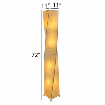 In a entryway beside a console table, the Twist Giant Floor crafted by the artisans of Eangee Home Design Lamp in natural finish by Eangee Home Design stands beside a ceramic vase, its fossilized cocoa leaf panels, powder coated wrought iron frame, wrought iron frame, and hand placed natural leaves casting a warm glow that there's a quiet drama to the twist giant floor lamp like a sculpture mid turn, caught in motion.