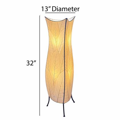 In a minimalist den with wooden accents, the Flowerbud Large Floor crafted by the artisans of Eangee Home Design Lamp in natural finish by Eangee Home Design stands tall, its fossilized cocoa leaf panels and hand placed natural leaves casting a warm glow that the flower bud large floor lamp draws you in before it even lights up.