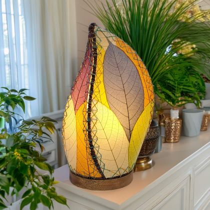 Leaf?shaped Leaflet table lamp crafted by Eangee Home Design with multi color fossilized cocoa leaves stitched by hand to wrought iron; budding?leaf form breathes life as ambient light filters across the textured leaf panels; sustainably handcrafted by skilled artisans