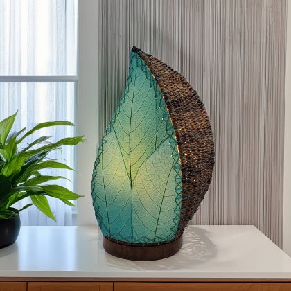 Leaf?shaped Leaflet table lamp crafted by Eangee Home Design with sea blue fossilized cocoa leaves stitched by hand to wrought iron; budding?leaf form breathes life as radiant light spills across the textured leaf panels; artisan?made with renewable materials
