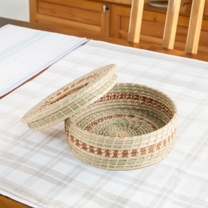 Handwoven V-shaped basket made from rattan and bamboo
