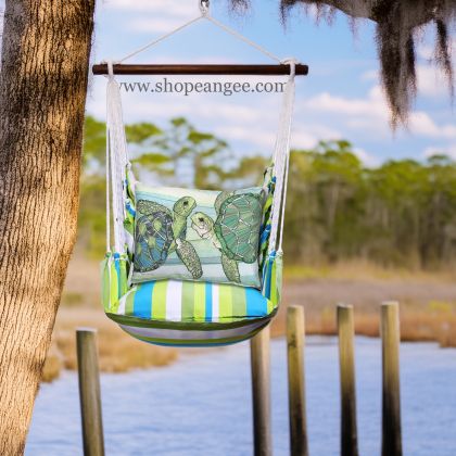 In a coastal inspired deck chair a sea outdoor swing crafted by the artisans of Magnolia Casual called the Swing Set 4 piece Beach Boulevard Stripe w/ Sea Turtle Pair is displayed featuring 100 percent weather resistant fabric, weather resistant polyester fabric adding comfort and style to the space featuring with a stripe motif.