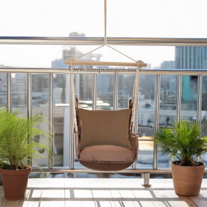 In a sunlit patio lounge a multi colored outdoor swing crafted by the artisans of Magnolia Casual called the Swing Set 4 piece Chocolate Solid w/ Chocolate Solid is displayed featuring 100 percent weather resistant fabric, weather resistant polyester fabric, artisan, natural materials adding comfort and style to the space.