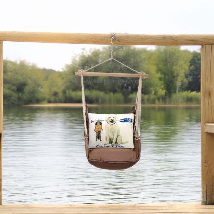 In a coastal inspired deck chair a multi colored outdoor swing crafted by the artisans of Magnolia Casual called the Swing Set 4 piece Chocolate Solid w/ Lake Time is displayed featuring 100 percent weather resistant fabric, weather resistant polyester fabric, artisan, natural materials adding comfort and style to the space.