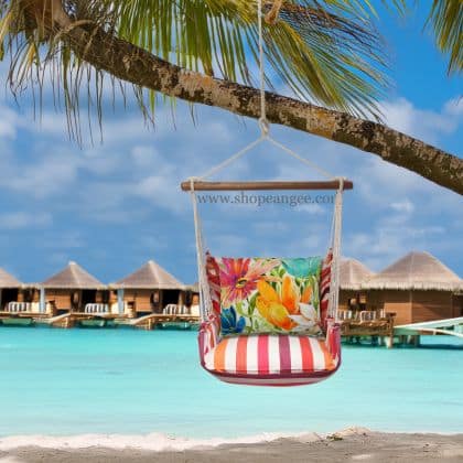 In a sunlit patio lounge a multi colored outdoor swing crafted by the artisans of Magnolia Casual called the Swing Set 4 piece Cristina Stripe w/ Tropical 1 is displayed featuring 100 percent weather resistant fabric, weather resistant polyester fabric, handcrafted adding comfort and style to the space featuring with a stripe motif.