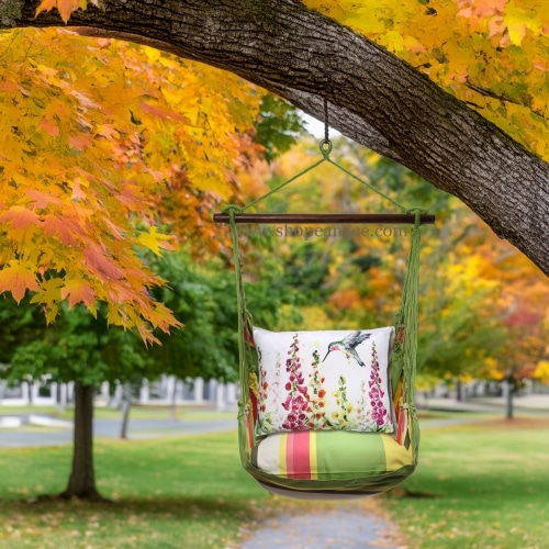In a coastal inspired deck chair a multi colored outdoor swing crafted by the artisans of Magnolia Casual called the Swing Set 4 piece Fresh Lime Stripe w/ Foxgloves w/ Hummingbird is displayed featuring 100 percent weather resistant fabric, weather resistant polyester fabric, handcrafted adding comfort and style to the space featuring with a stripe motif and shades of lime.