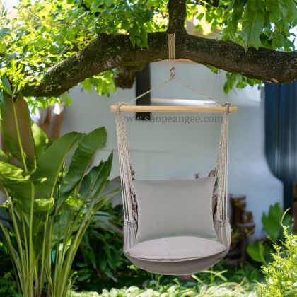 In a poolside chaise a gray outdoor swing crafted by the artisans of Magnolia Casual called the Swing Set 4 piece Gray Solid w/ Gray Solid is displayed featuring 100 percent weather resistant fabric, weather resistant polyester fabric, handcrafted adding comfort and style to the space featuring shades of gray.