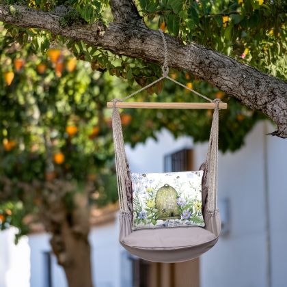 In a cozy garden seating area a gray outdoor swing crafted by the artisans of Magnolia Casual called the Swing Set 4 piece Gray Solid w/ Bee Skep is displayed featuring 100 percent weather resistant fabric, weather resistant polyester fabric, handcrafted adding comfort and style to the space featuring with a bee motif and shades of gray.