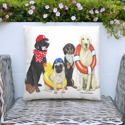 In an outdoor reading nook a multi colored outdoor pillow crafted by the artisans of Magnolia Casual called the Outdoor Pillow Dogs of Summer 18x18 is displayed featuring quality outdoor fabric adding comfort and style to the space.