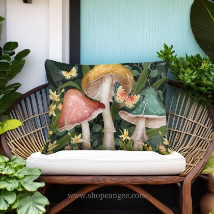 In a sunlit patio lounge a multi colored outdoor pillow crafted by the artisans of Magnolia Casual called the Outdoor Pillow Mushroom Trio 19x24 is displayed featuring handwoven textile adding comfort and style to the space.