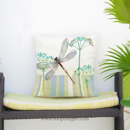 In a coastal inspired deck chair a multi colored outdoor pillow crafted by the artisans of Magnolia Casual called the Outdoor Pillow Dragonfly Wisp 18x18 is displayed featuring quality outdoor fabric adding comfort and style to the space featuring with a dragonfly motif.