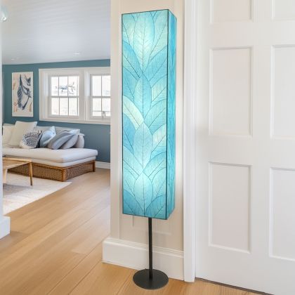 Sequoia Giant Floor Lamp in sea blue by Eangee Home Design - tall rectangular column wrapped in fossilized cocoa leaf panels hand-stitched to a powder-coated frame; softly  casts a tranquil blue glow that adds coastal calm to the room.