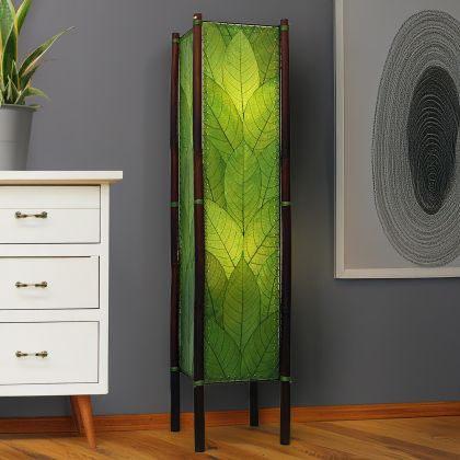 Green Fortune square floor lamp, fossilized cocoa leaf shade on bamboo legs with abaca stitch, illuminating modern room by Eangee Home Design