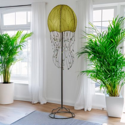 Green Jellyfish Large Floor Lamp by Eangee Home Design - dome shade formed from fossilized cocoa leaves with iron tendril 'tentacles' dotted by glass beads; radiates a calming ambient light while lending artful biophilic texture.