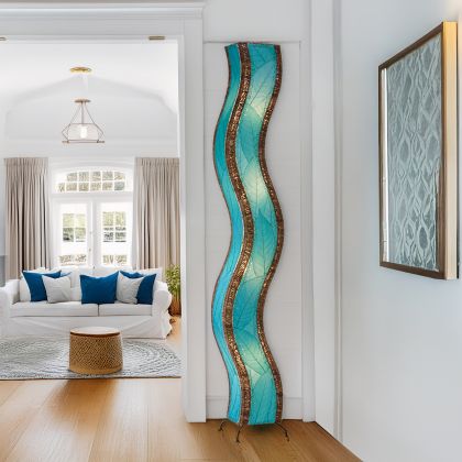 Sea Blue Wave Giant Floor Lamp by Eangee Home Design - tall S?curve column clad in sea?blue fossilized cocoa leaf panels bordered with natural abaca; handcrafted lamp casts a calming ocean?toned glow that animates the doorway.