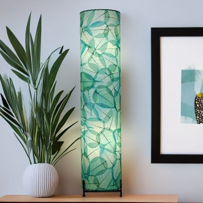 Sea blue Banyan large floor lamp, tall cylinder of fossilized banyan leaves on black iron base, emits soothing coastal glow by Eangee Home Design