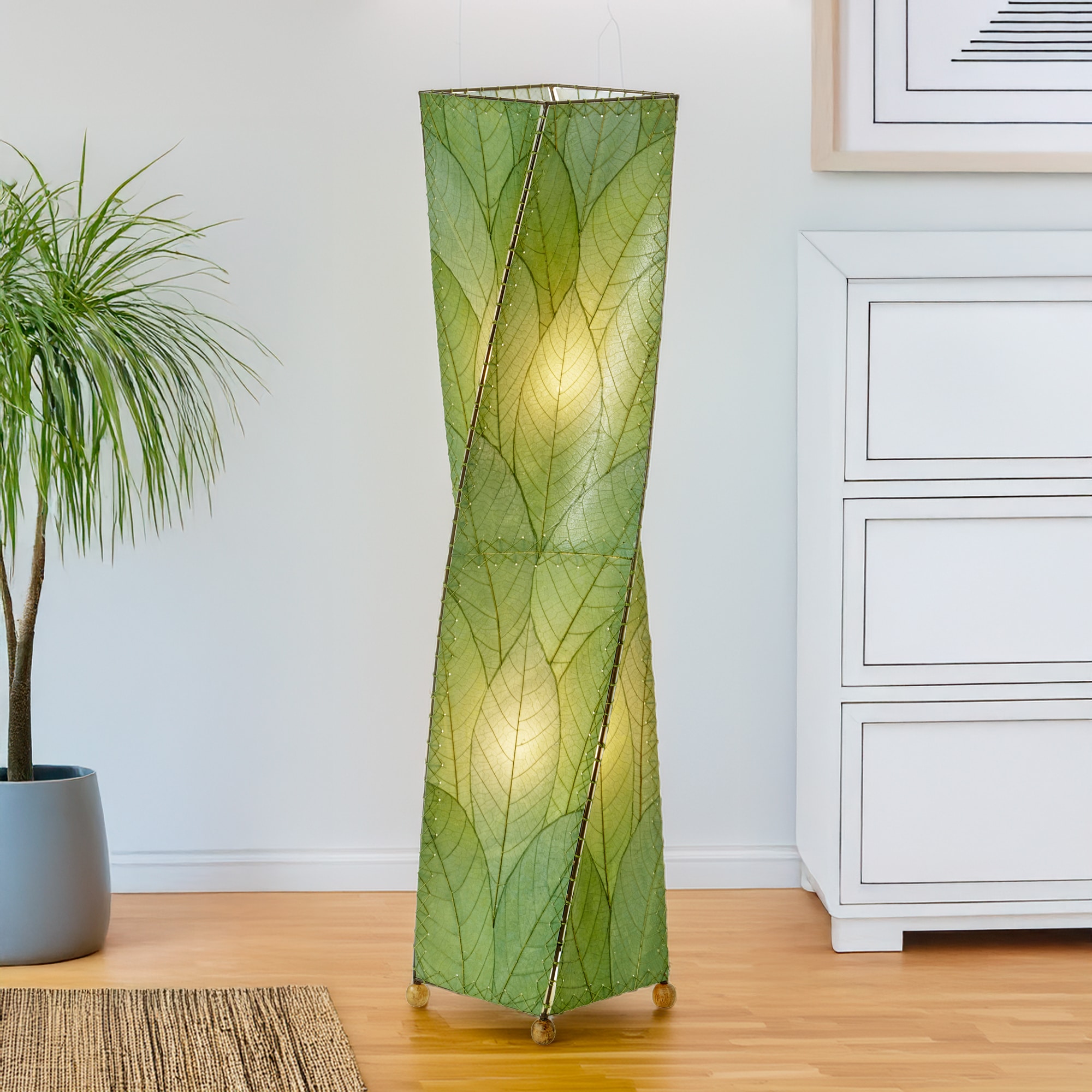 Green Twist Large Floor Lamp by Eangee Home Design - graceful twisting column clad in green fossilized cocoa leaves; hand stitched design diffuses fresh nature inspired light.