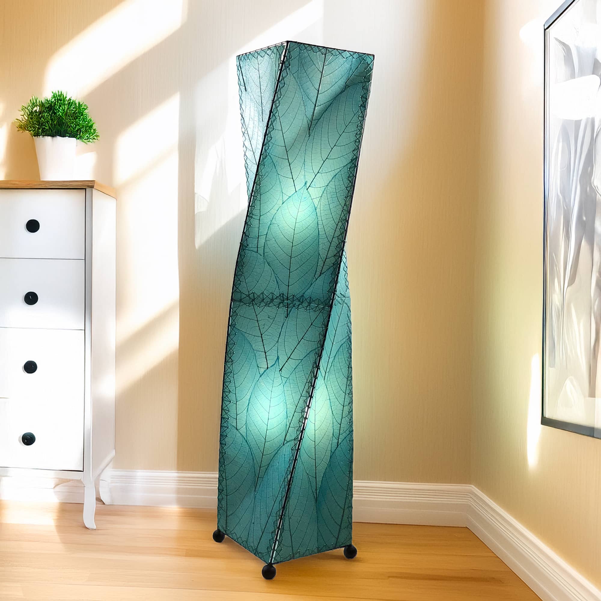 Sea Blue Twist Large Floor Lamp by Eangee Home Design - tall twisting column wrapped in sea blue fossilized cocoa leaves with abaca trim; artisan fixture casts a tranquil ocean toned glow.