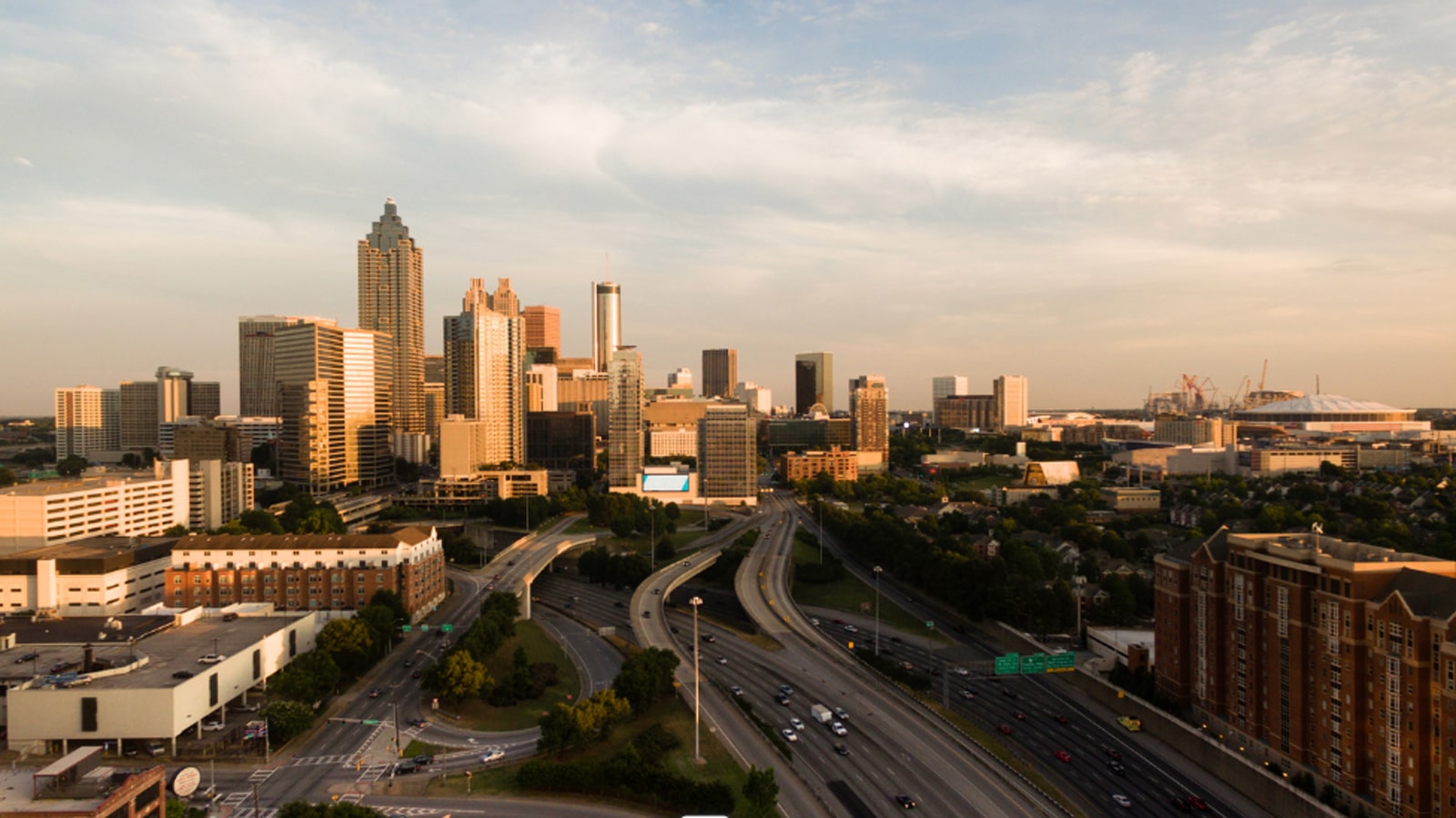 Earth Day 56 years later image of a clear American city skyline under blue sky
