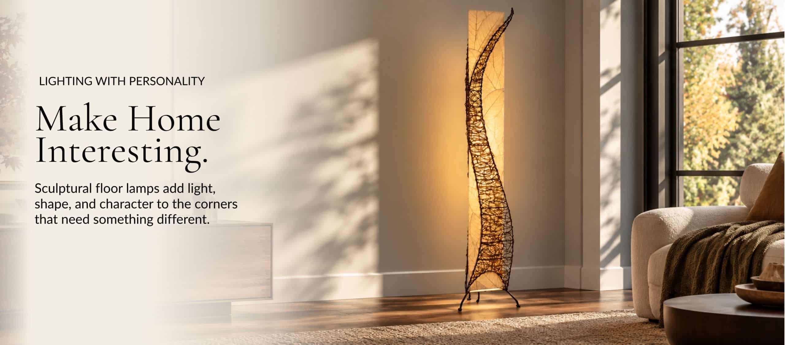 Make Home Interesting. A glowing sculptural floor lamp made with real leaves beside a sofa in a sunlit living room.