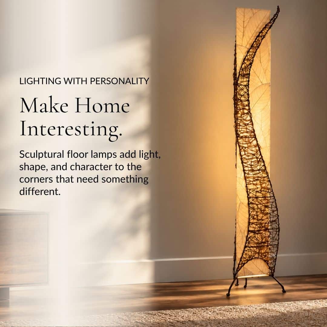 Make Home Interesting. A sculptural floor lamp with a shade made from real leaves glows beside an armchair.